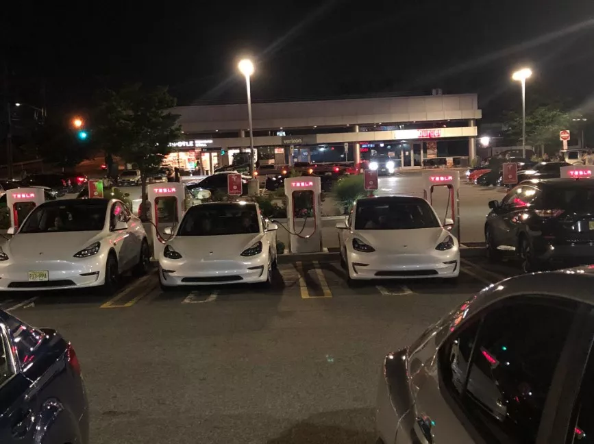 Tesla sedans charging at a Wawa